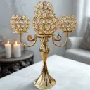 5 candles placement candle stand, gold in color with glass pebbles on sides used for home decoration
